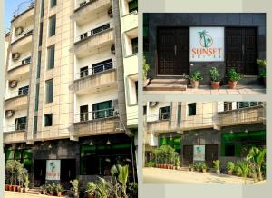 un edificio con una señal de sol en el costado. en Sunset Suites en Karachi