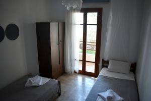 Postel nebo postele na pokoji v ubytování Poseidon Apartments