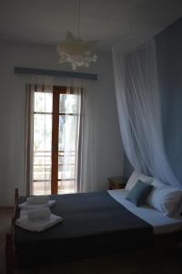 Postel nebo postele na pokoji v ubytování Poseidon Apartments