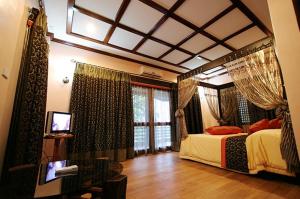 Giường trong phòng chung tại Kamayan sa Palaisdaan