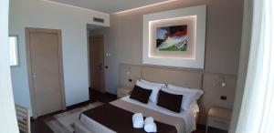 Posteľ alebo postele v izbe v ubytovaní Villa Cerniglia Plus