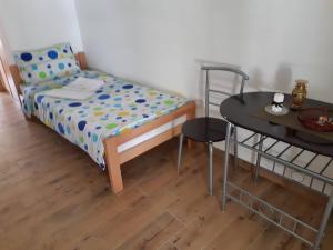Voodi või voodid majutusasutuse Apartmani Gmitrovic toas