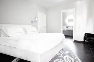 La Suite Boutique Hotel客房内的一张或多张床位