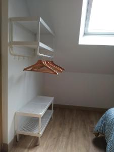 a room with white shelves and a window at Duplex/Beauval & Châteaux in Selles-sur-Cher