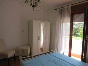 Postel nebo postele na pokoji v ubytování Apartments Mićo