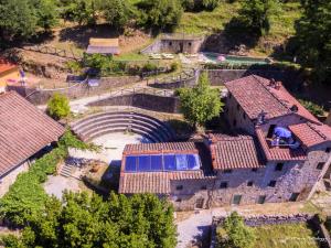 an aerial view of a house with a tunnel at Agriturismo Pian di Fiume in Bagni di Lucca