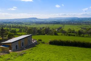 an aerial view of a farmhouse in a field at The Chicken Shed at Knowle Top in Clitheroe