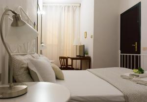 Lova arba lovos apgyvendinimo įstaigoje Santa Croce Exclusive