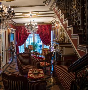 
a living room filled with furniture and decorations at Guest House Vivaldi in Niš
