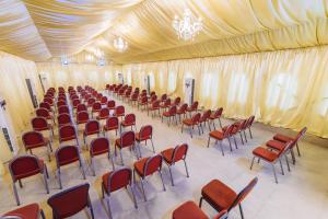 a large tent with chairs and tables in it at Tranquil Mews Hotel in Abuja