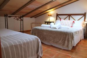 Tempat tidur dalam kamar di Masia Can Magan Lux, Ideal Grupos 20pax