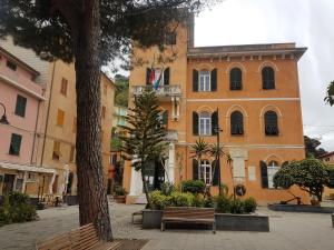 a building with a bench in front of it at Monterosso Servano's Villas in Monterosso al Mare