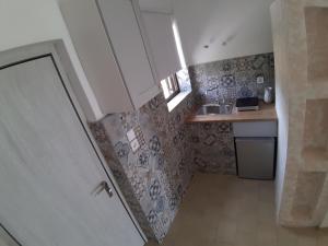 Kuchyň nebo kuchyňský kout v ubytování Filio Guesthouse