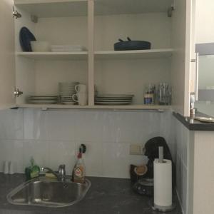 Kuchyň nebo kuchyňský kout v ubytování Studio Hippique + 39 fotografií