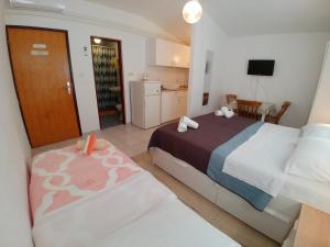 Postel nebo postele na pokoji v ubytování Apartmani Sali Seaview