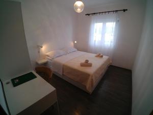 Postel nebo postele na pokoji v ubytování Apartmani Sali Seaview