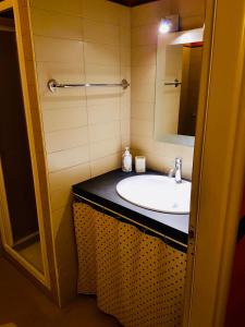 a bathroom with a sink and a mirror at LA CASA DI NONNO GINO in Levanto