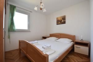 Łóżko lub łóżka w pokoju w obiekcie Apartment Put Slanice in Murter