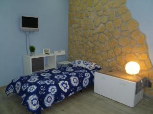 A bed or beds in a room at Casa Alessio