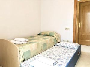 Кровать или кровати в номере Apartamentos Benet