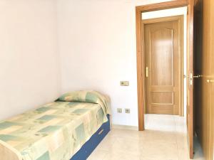 Кровать или кровати в номере Apartamentos Benet