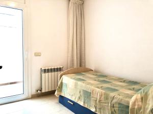 Кровать или кровати в номере Apartamentos Benet