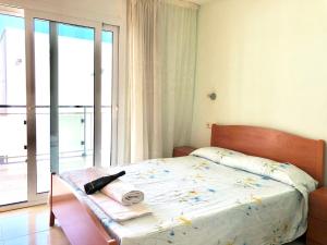 Кровать или кровати в номере Apartamentos Benet