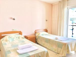 Кровать или кровати в номере Apartamentos Benet