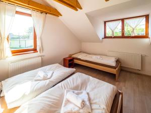 Posteľ alebo postele v izbe v ubytovaní Penzion Pastouška s pohostinstvím