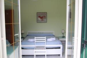 Postel nebo postele na pokoji v ubytování Palia's Hotel