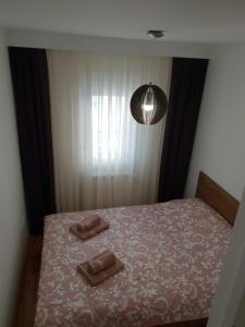 Postel nebo postele na pokoji v ubytování Tvoj Apartman