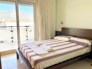 Кровать или кровати в номере Apartamentos Benet