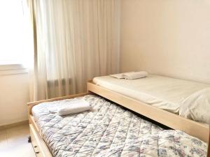 Кровать или кровати в номере Apartamentos Benet