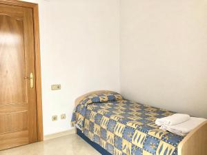 Кровать или кровати в номере Apartamentos Benet