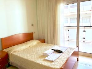 Кровать или кровати в номере Apartamentos Benet