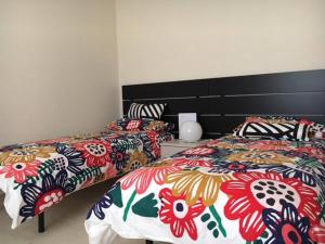 A bed or beds in a room at Appartamento Gran Sasso - Guest house