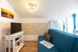 TV a/nebo společenská místnost v ubytování Apartments CAPE Deluxe