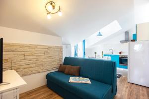 Kuchyň nebo kuchyňský kout v ubytování Apartments CAPE Deluxe
