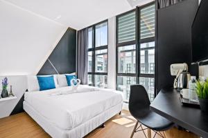 Postel nebo postele na pokoji v ubytování Rica Hotel Usj