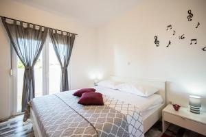 Postel nebo postele na pokoji v ubytování Apartments CAPE Deluxe