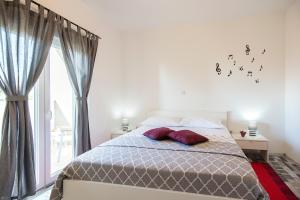 Postel nebo postele na pokoji v ubytování Apartments CAPE Deluxe