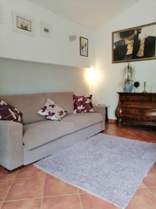 a living room with a couch and a piano at Apartment Džoni in Split