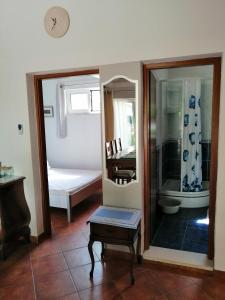 a room with a mirror and a table and a tub at Apartment Džoni in Split