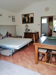 a living room with a bed and a table at Apartment Džoni in Split