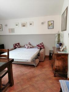 a bedroom with a bed and a couch in it at Apartment Džoni in Split