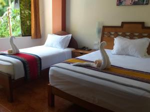 Voodi või voodid majutusasutuse Hostal Vista Waynapata 123 toas