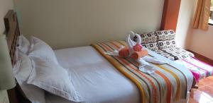 Voodi või voodid majutusasutuse Hostal Vista Waynapata 123 toas