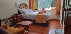 Voodi või voodid majutusasutuse Hostal Vista Waynapata 123 toas