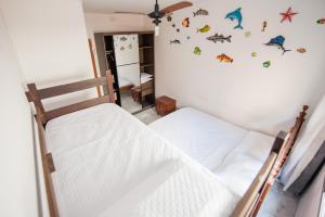 Lova arba lovos apgyvendinimo įstaigoje Apartamento pertinho do mar