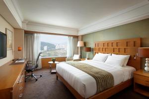 Postel nebo postele na pokoji v ubytování Lotte Hotel Busan